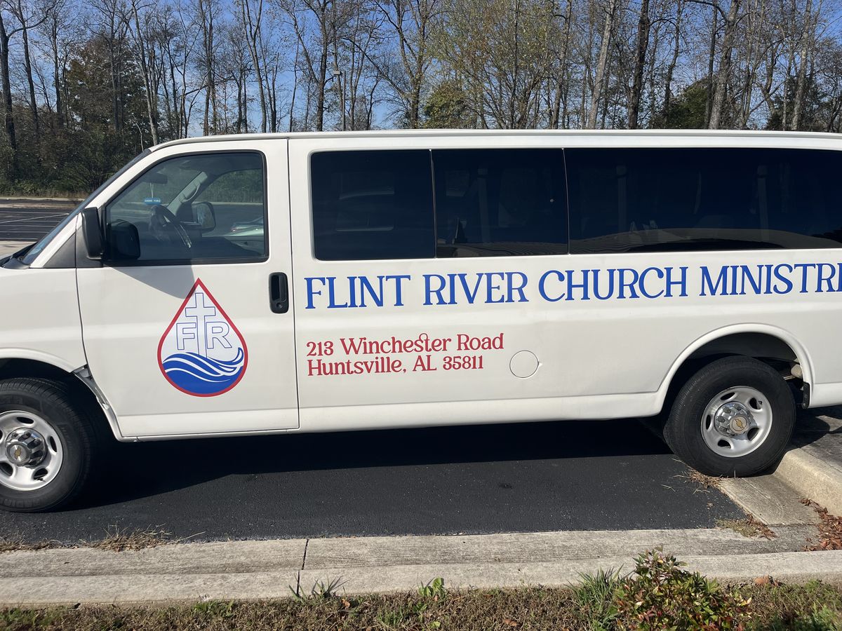 White Flint River Church Ministries van with the church logo and address